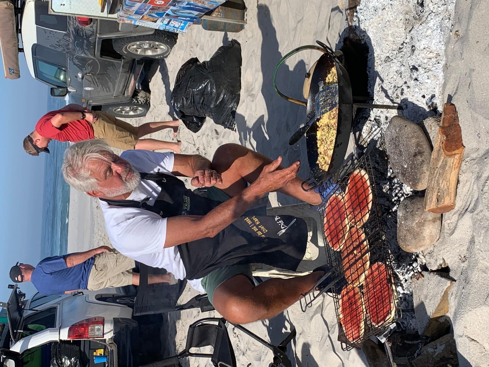 Guest displaying fresh mussel catch at the beach